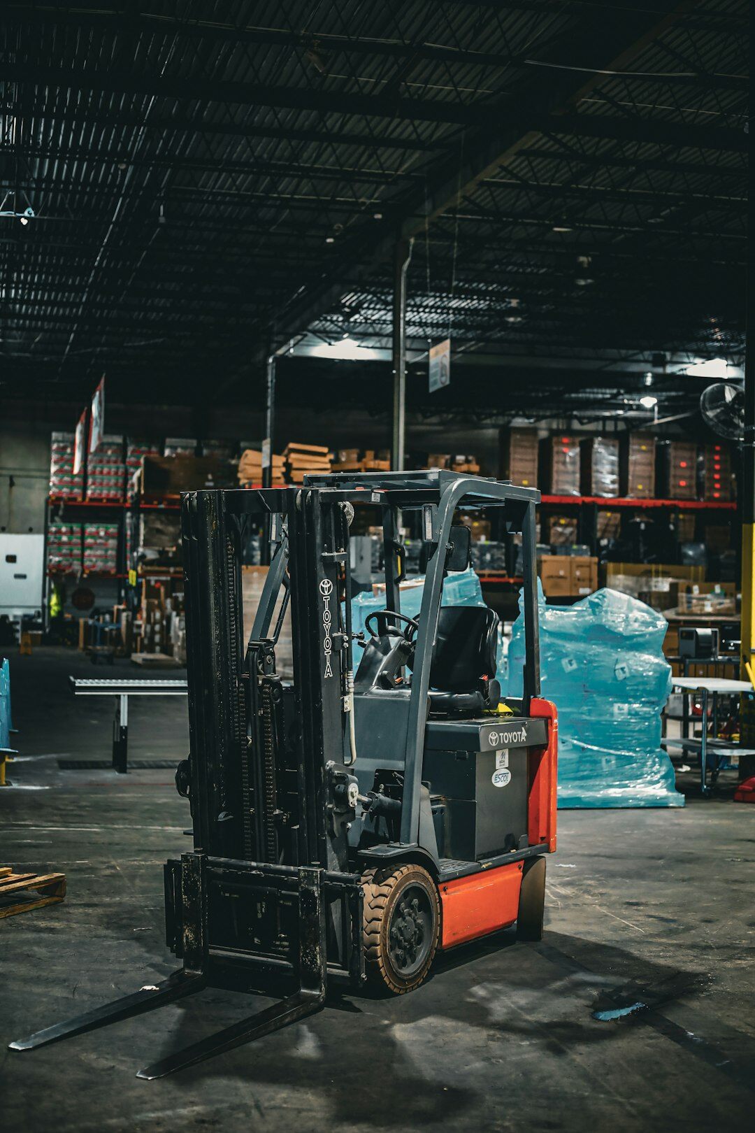 Logistics warehouse with shelves and forklift